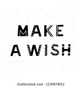 Hand drawn black scandinavian lettering make a wish isolated on white background.