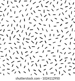 Hand drawn black and white abstract confetti seamless pattern. Pop art fashion festival abstract background in memphis style.