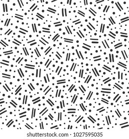 Hand drawn black and white abstract confetti seamless pattern. Pop art fashion festival abstract background in memphis style.