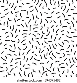 Hand drawn black and white abstract confetti seamless pattern. Vector geometric pattern in retro memphis style. Striped background.