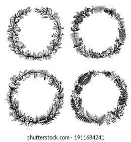 Hand drawn black and white ink circle wreaths of forest plants and berries.