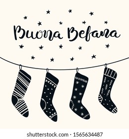 Hand drawn black and white vector illustration with hanging Christmas stockings on a string, stars, Italian text Buona Befana, Happy Epiphany. Flat style design. Concept holiday card, poster, banner.