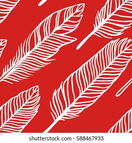 Hand drawn boho illustration. Red seamless pattern with feathers. Vector creative art-work. Ink drawing in bohemian chic style
