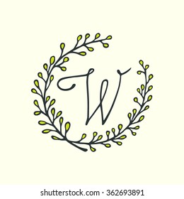 Hand drawn botanical monogram with W character in floral wreath made in vector. 