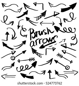 Hand drawn brush arrow. Sketch design concept. Set arrows isolated on the white background. 