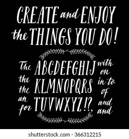 Hand drawn brush ink vector ABC letters set with calligraphic articles and prepositions. Trendy doodle calligraphy font for your design.

