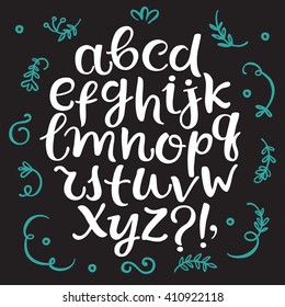 Hand drawn brush ink vector font. Lower case ABC  letters set with doodle floral elements. Curly decorative font for your design.
