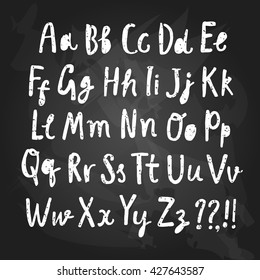 Hand drawn brush ink vector ABC letters set on blackboard background. Grungy textured comic font for your design.