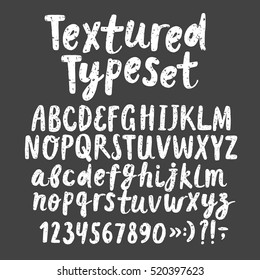 Hand drawn brush ink vector ABC letters and figures set. Grungy textured comic typeset for your design.