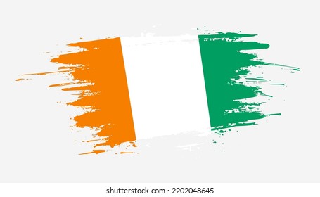 Hand drawn brush stroke flag of Cote dIvoire. Creative national day hand painted brush illustration on white background