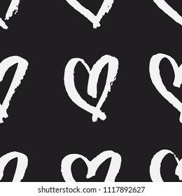 Hand drawn brush stroke hearts seamless vector pattern in black & white. Texture for Valentine’s Day. Monochrome romantic love illustration repetitive background with handmade grungy artistic strokes.