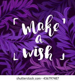 Hand drawn calligraphy "make a wish" on purple and blue leaves background. creative graphic template brush fonts inspirational   quotes