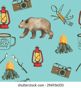 Hand drawn camping seamless pattern with watercolor elements. Camp bonfire, vintage lantern, photo camera, camper knife, enamel mug. Turquoise background