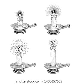 Hand drawn candle set. Burning candle in an old candlestick engraved in retro style. Vector illustration
