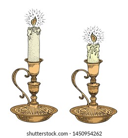 Hand drawn candle set. Burning candle in an old candlestick engraved in retro style. Vector illustration