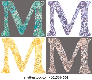 Hand drawn capital letter M in turquoise, purple, yellow and pink