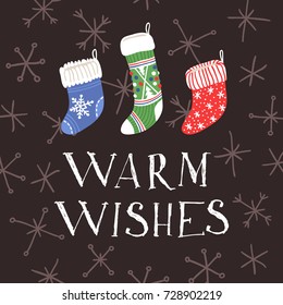 Hand drawn card with Christmas socks for gifts and text Warm wishes. Holidays background. Abstract  doodle drawing. Vector art illustration