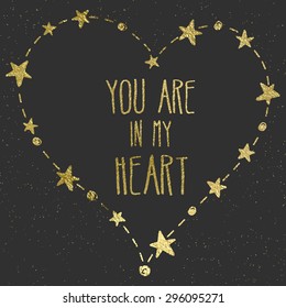 Hand drawn card with gold foil heart. For wedding, Valentine's Day, and declaration of love. "You are in my heart" lettering. Black background.