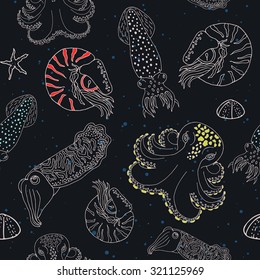 Hand drawn cephalopods seamless pattern. Black blue dotted background with color spotted vector octopus, squid calmar, nautilus and cuttlefish