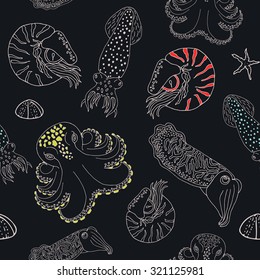 Hand drawn cephalopods seamless pattern. Black blue background with color spoted vector octopus, squid calmar, nautilus and cuttlefish