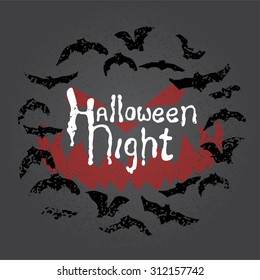 Hand drawn chalk lettering on chalkboard. Happy halloween postcard with round bat frame. Vector design.