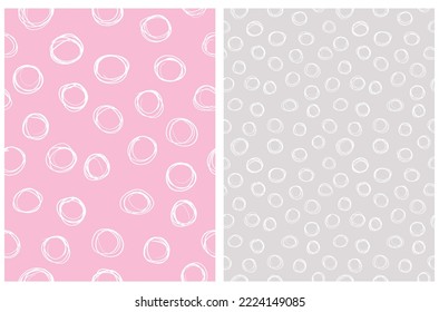 Hand Drawn Childish Style Seamless Vector Pattern Set. Irregular White Circles on a Pastel Pink and Gray Background. Cute Simple Geometric Repeatable Design ideal for Fabric, Textile, Wrapping Paper.