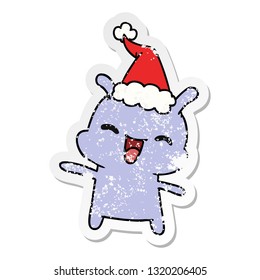 hand drawn christmas distressed sticker cartoon of kawaii alien