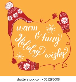 Hand drawn Christmas and New Year greeting card design. Knitted winter hat and mittens with snowflakes, handwritten christmas lettering. Orange background