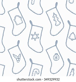 Hand drawn christmas sewn socks outline seamless pattern. Holiday background in blue and white colors. Vector illustration