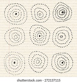 Hand drawn circle pattern on a sheet of lined paper