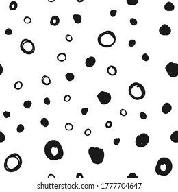 Hand drawn circles seamless pattern. Random dots loop texture background.