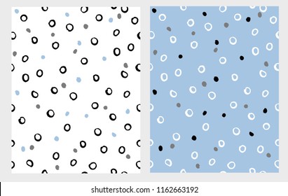 Hand Drawn Circles Seamless Vector Paterns Set. Black Round Shape on a White Background. White Elements on a Blue Layout. Brush Tiny Spots. Cute Abstract Graphic. Irregular Design. 