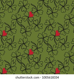 Hand drawn clover vector pattern in a green and red color palette