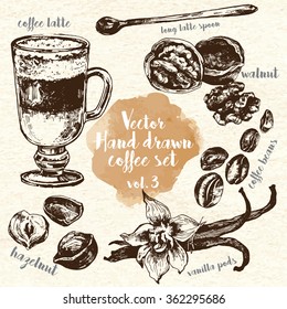 Hand Drawn Coffee Set vol. 3. 
Including coffee latte, walnut, vanilla pods, coffee beans, hazelnut and long latte spoon. Design elements for restaurants and menus. Ink drawn vintage style.