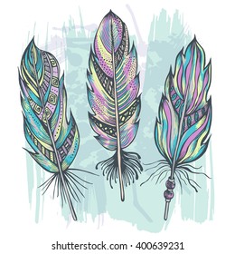 Hand drawn colored decorative feathers. Trendy elements in boho style. Vector illustration.