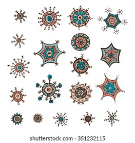 Hand drawn colorful snowflakes doodle. Tribal circular patterns. Abstract round design elements.