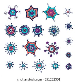 Hand drawn colorful snowflakes doodle. Tribal circular patterns. Abstract round design elements.