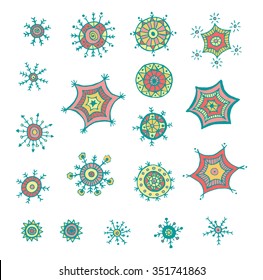 Hand drawn colorful snowflakes doodle. Tribal circular patterns. Abstract round design elements.