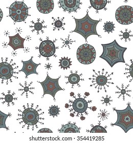 Hand drawn colorful snowflakes doodles arranged in a seamless pattern. Tribal circular patterns. Abstract round design elements.