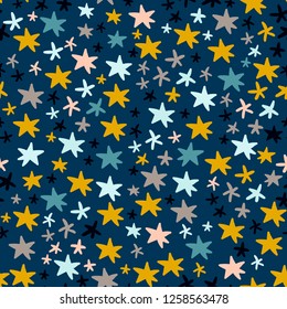 Hand drawn colorful stars. Doodle shapes. Vector seamless pattern. Blue background