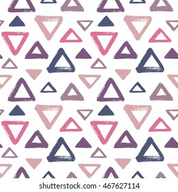 Hand drawn colorful triangles seamless vector pattern. Geometric doodle style background. Abstract brush drawn texture. Various triangle shapes or silhouettes with rough, uneven edges.