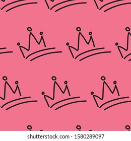 Hand drawn crowns of king or queen girly seamless pattern. Crowns at pink background for textile texture, cover paper, books. 