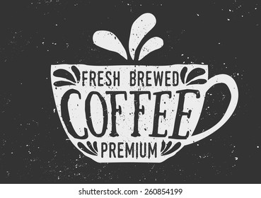 Hand drawn cup of coffee with text and decorative elements. Chalkboard style vector illustration.