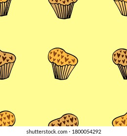 hand drawn cupcakes with chocolate chips - seamless pattern on yellow background. Vector illustration in doodle style with sweet pastries with black outline