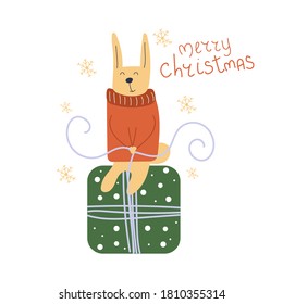 Hand drawn cute Bunny in a sweater sits on a gift and ties a bow. Text Merry Christmas. Flat illustration.