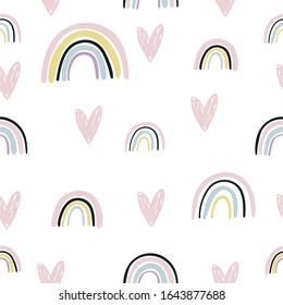 Hand drawn cute rainbow seamless pattern. Rainbow print for baby textiles, fabrics and baby shower cards.