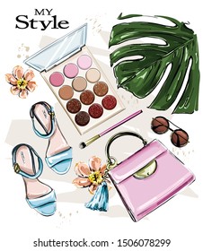 Hand drawn cute set with cosmetics and female accessories. Beautiful fashion set with eyeshadows, sunglasses, makeup brush, bag, shoes, flowers and palm leaf. Flat lay. Vector illustration.