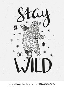 Hand drawn dancing bear. Vector sketch illustration with stylish lettering "stay wild"