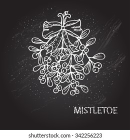 Hand drawn decorative christmas mistletoe, design element. Can be used for cards, invitations, gift wrap, print, scrapbooking. Christmas and New Year background. Chalkboard