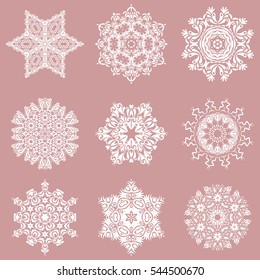 Hand drawn design with abstract winter doodles. Vector Merry Christmas and Happy New Year lettering quote. 9 snowflakes set on a neutral background.